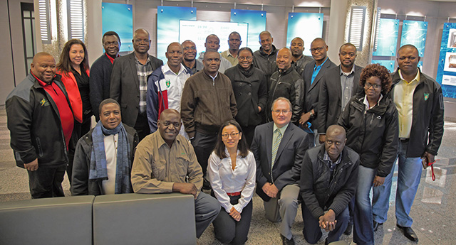 NYISO's Yachi Lin and Wes Yeomans pose with members of the Southern African Power Pool.